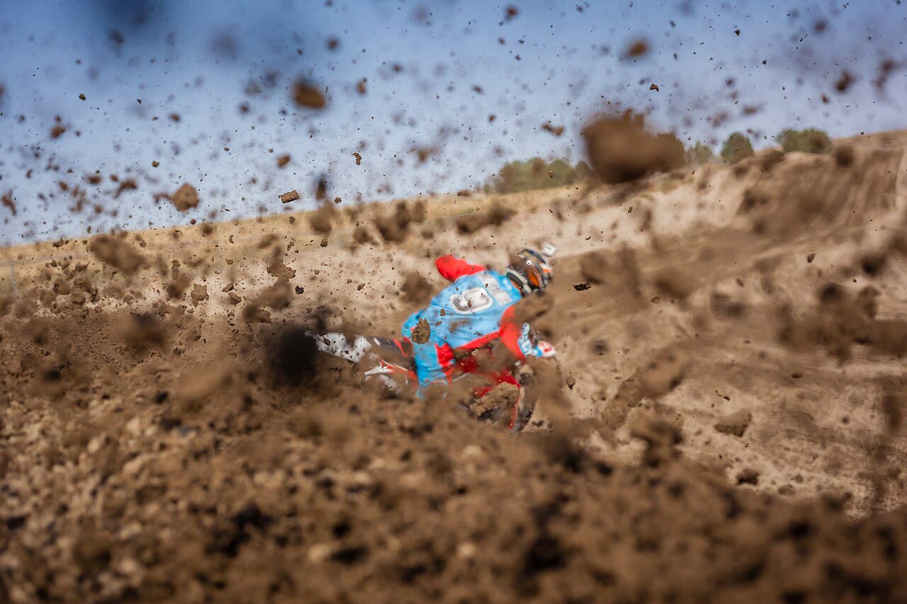 Motocross rider throwing dirt